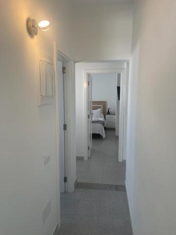 Postel nebo postele na pokoji v ubytování VILLAS NEW LANZASUITES PLUS