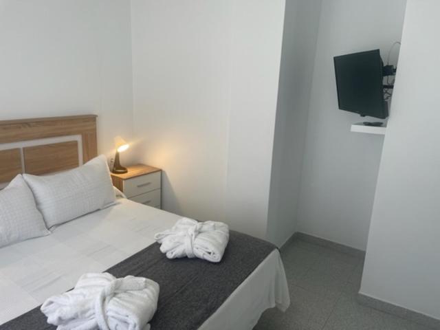 Postel nebo postele na pokoji v ubytování VILLAS NEW LANZASUITES PLUS