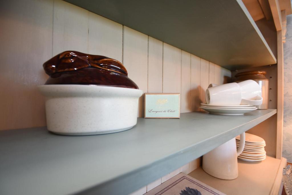 a kitchen shelf with a shoe on top of it at The Stables self catering in Seahouses