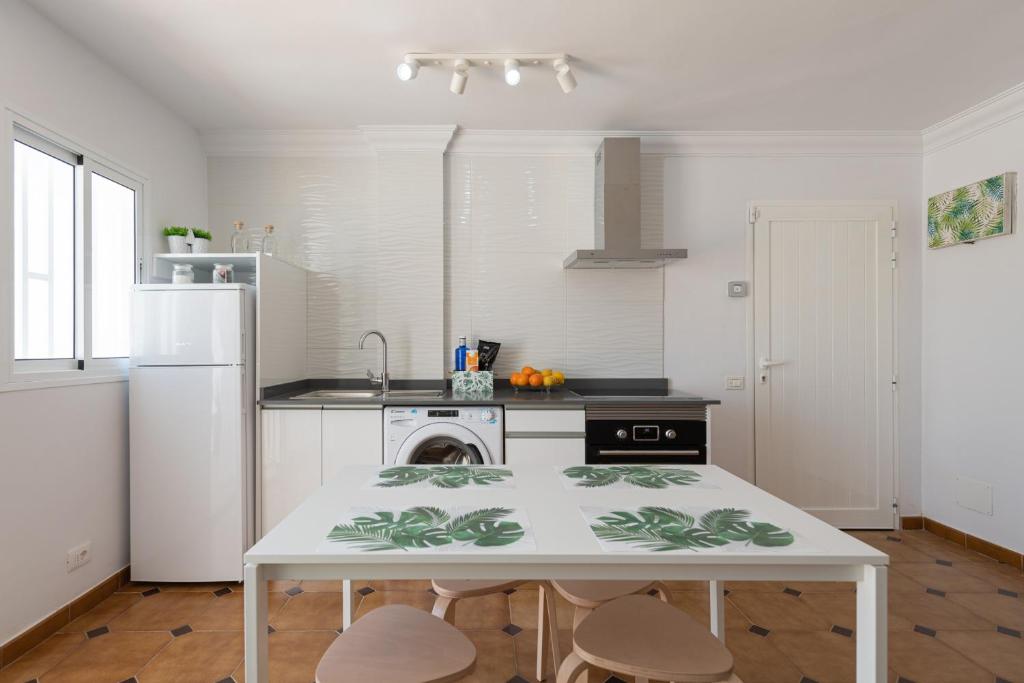 A kitchen or kitchenette at HomeForGuest A piece of oasis in the South of Gran Canaria