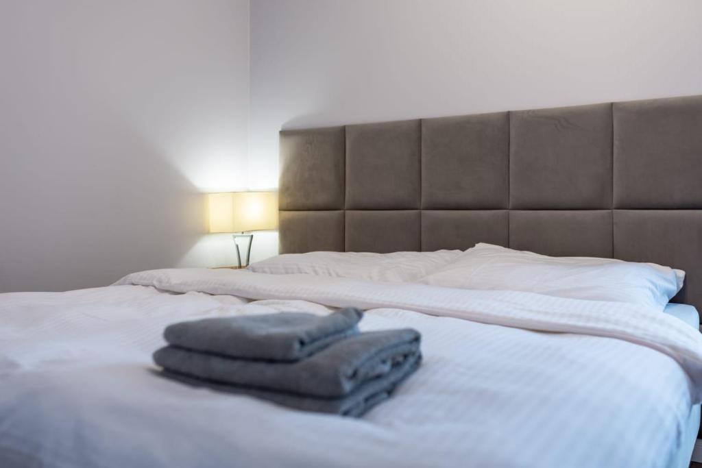 Posteľ alebo postele v izbe v ubytovaní Apartament Zaciszny