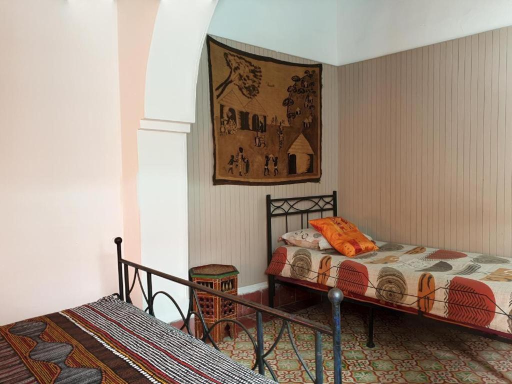Postel nebo postele na pokoji v ubytování Riad Sidi Magdoul