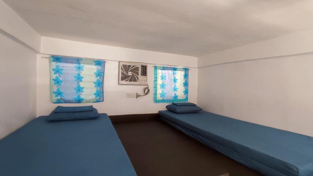 Postel nebo postele na pokoji v ubytování Ezekiel Transient House