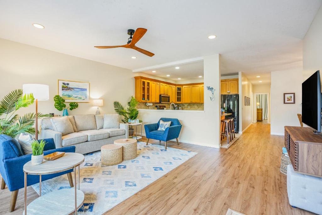 a living room with a couch and a table at Poipu Mermaid 912 in Koloa