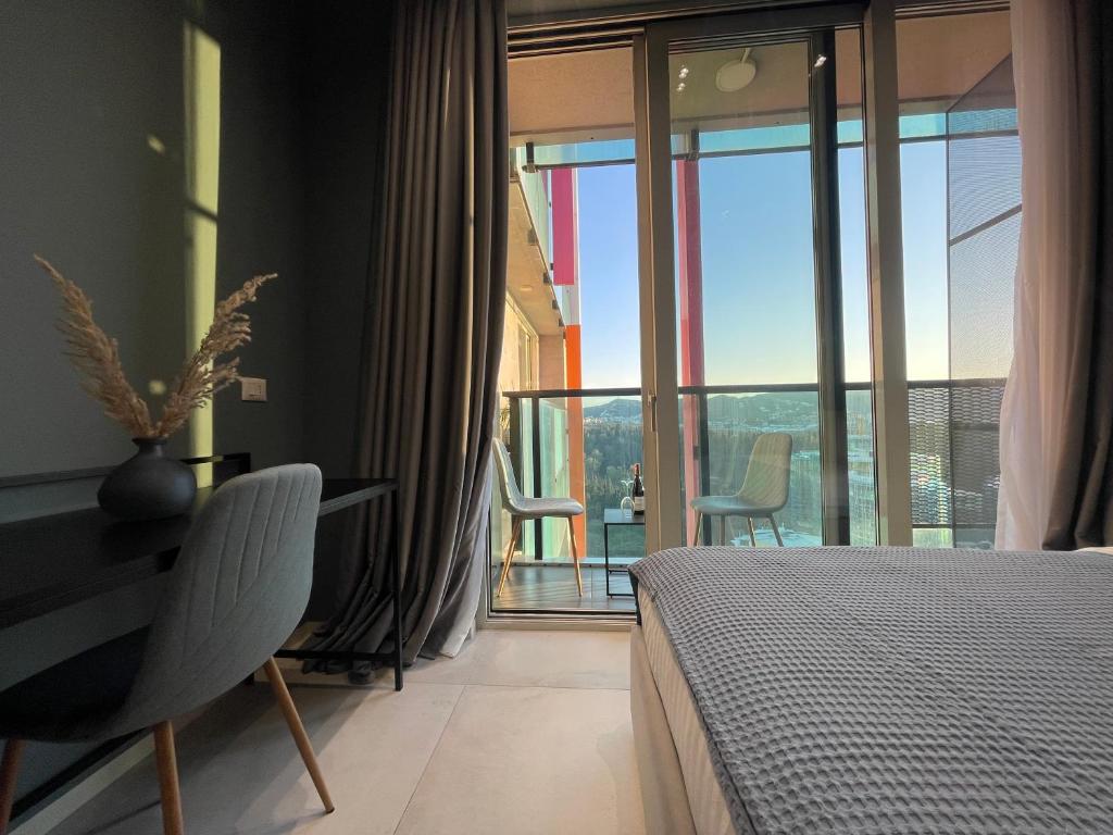 Postel nebo postele na pokoji v ubytování Ambassador Skyline Apartments