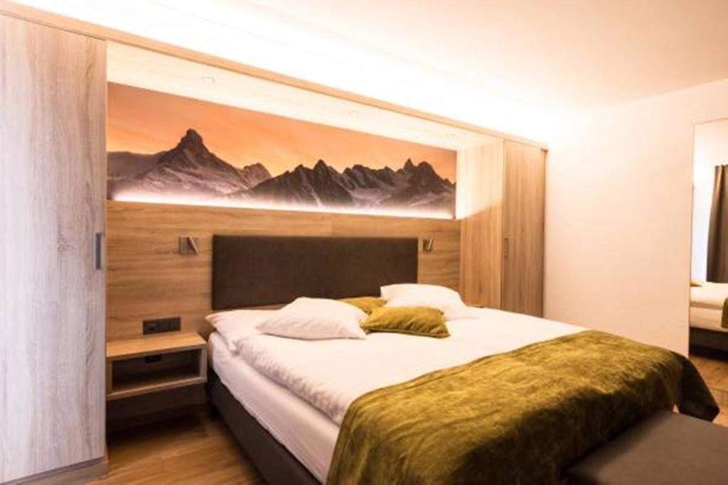 Postel nebo postele na pokoji v ubytování Hotel Bristol