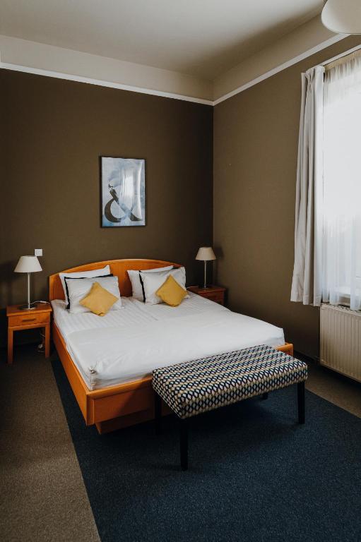 Postel nebo postele na pokoji v ubytování Hotel Piano