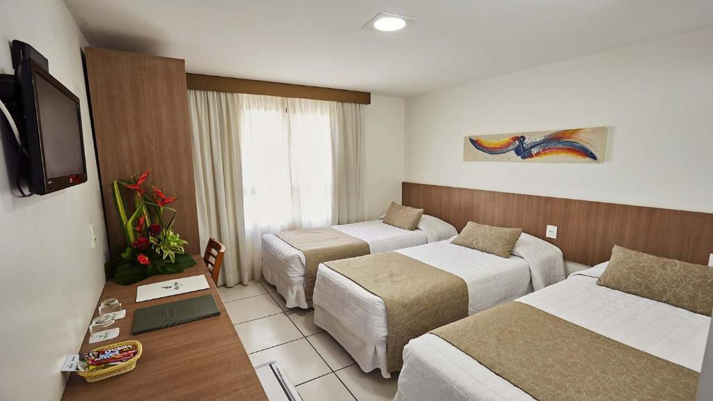 Cama ou camas em um quarto em Villa Park Hotel
