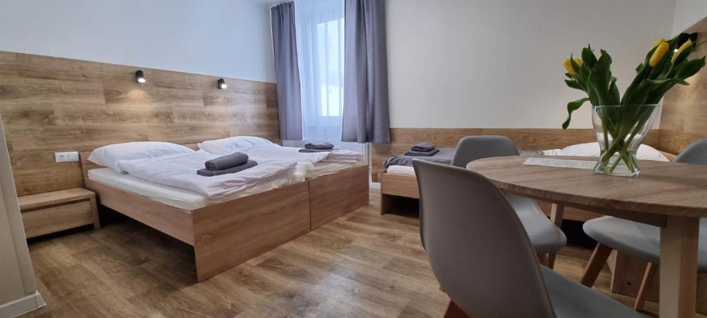 Posteľ alebo postele v izbe v ubytovaní Apartament, Pokoje Koniczynka