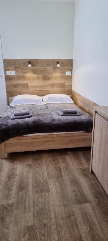 Posteľ alebo postele v izbe v ubytovaní Apartament, Pokoje Koniczynka