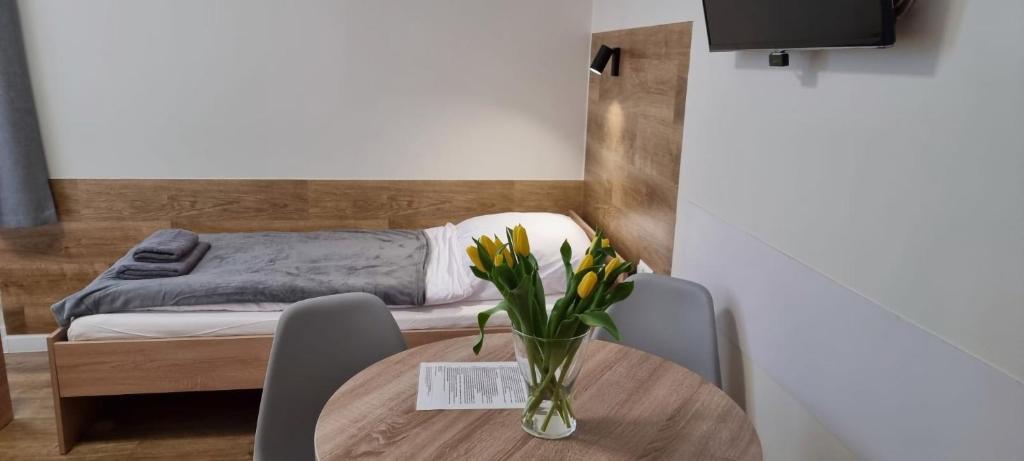 Posteľ alebo postele v izbe v ubytovaní Apartament, Pokoje Koniczynka