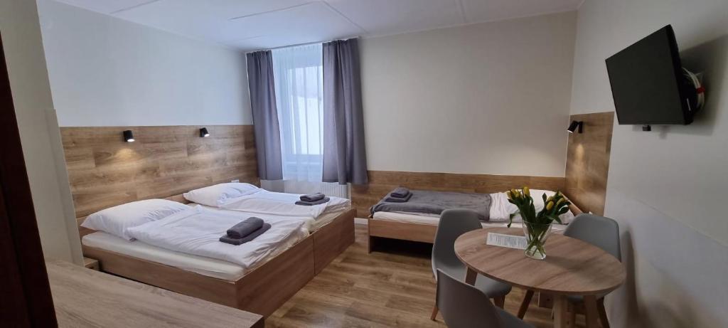 Posteľ alebo postele v izbe v ubytovaní Apartament, Pokoje Koniczynka