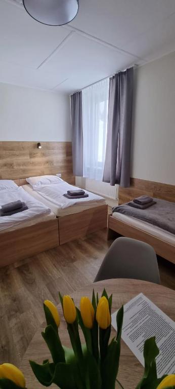 Posteľ alebo postele v izbe v ubytovaní Apartament, Pokoje Koniczynka