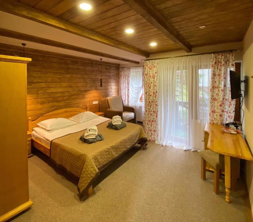 Postel nebo postele na pokoji v ubytování GORGANY resort & SPA