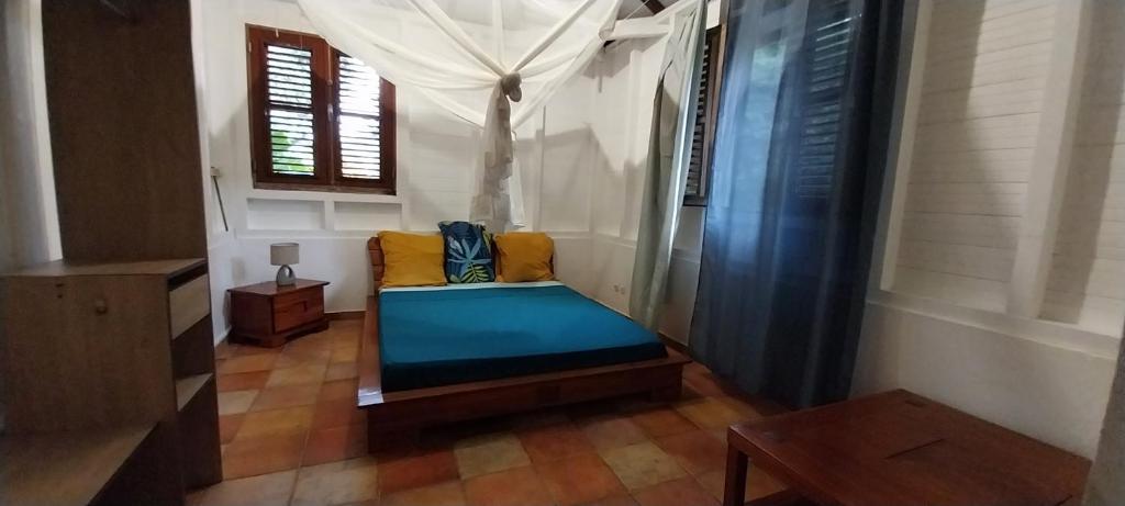 Ένα ή περισσότερα κρεβάτια σε δωμάτιο στο Villa CACAO