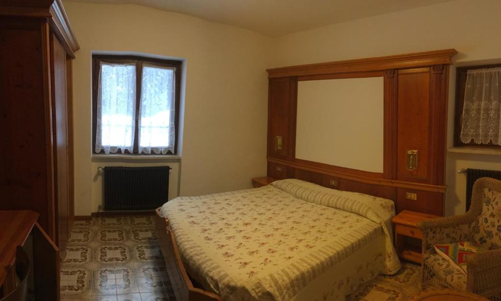 Postel nebo postele na pokoji v ubytování Appartamento Cogolo con terrazza 7 posti