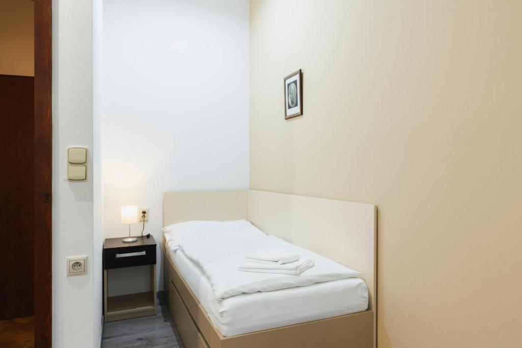 Postel nebo postele na pokoji v ubytování Penzion Dvořákova