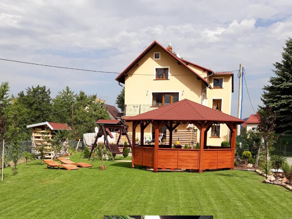 a house with a gazebo in a yard at Villa meisterburg in Ściegny