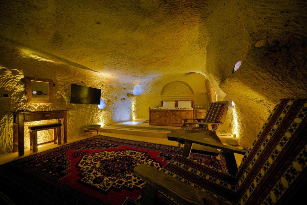 Postel nebo postele na pokoji v ubytování Babili Cappadocia Cave