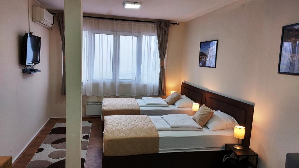 Postel nebo postele na pokoji v ubytování Hotel Villa Panorama