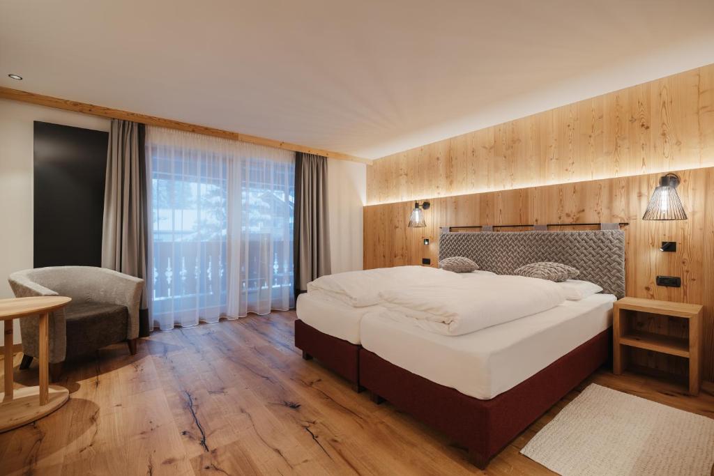 Postel nebo postele na pokoji v ubytování Albergo Posta Pederoa