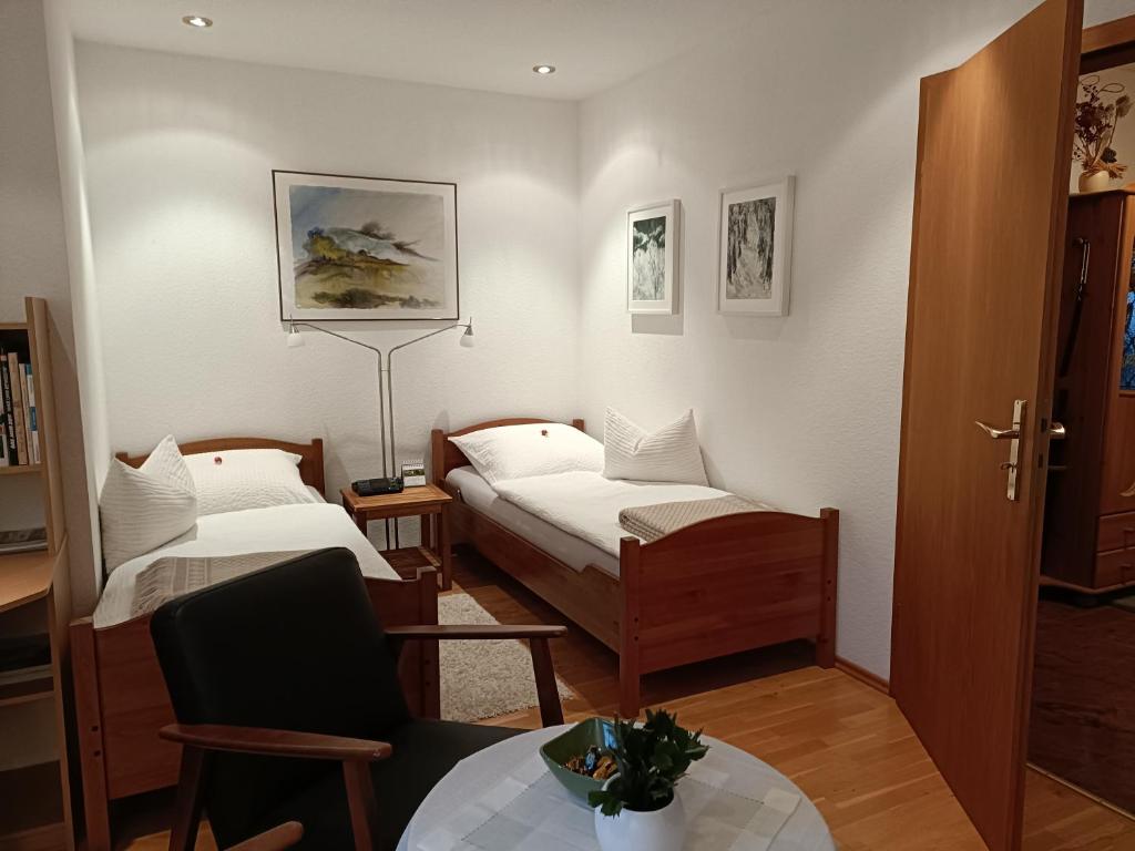 Postel nebo postele na pokoji v ubytování Apartment HAUS MERLIN am Böckelsberg