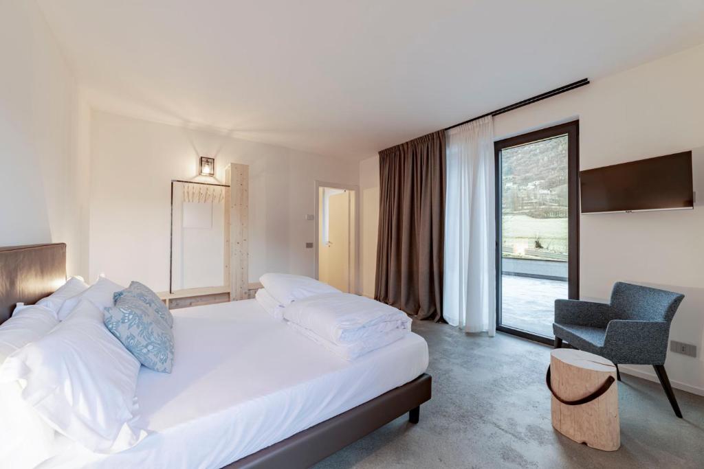 Postel nebo postele na pokoji v ubytování Agriturismo B&B Caffè e Vino