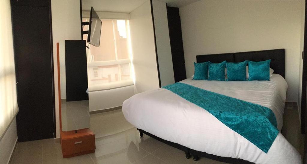 Cama o camas de una habitación en Elite Home Apartamentos