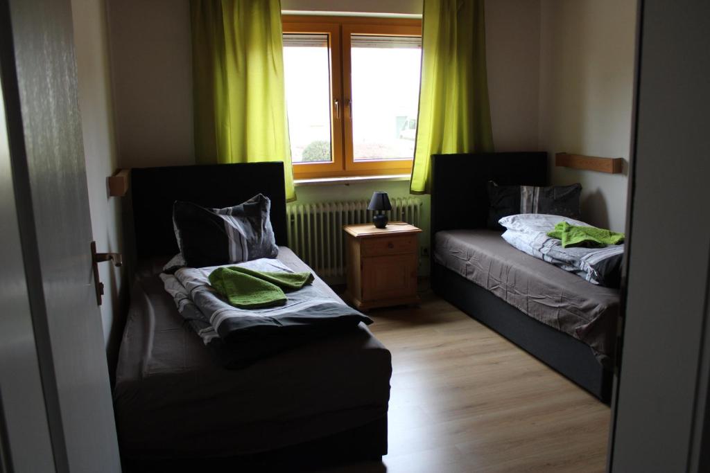 Postel nebo postele na pokoji v ubytování Hotel Garni Austermayer