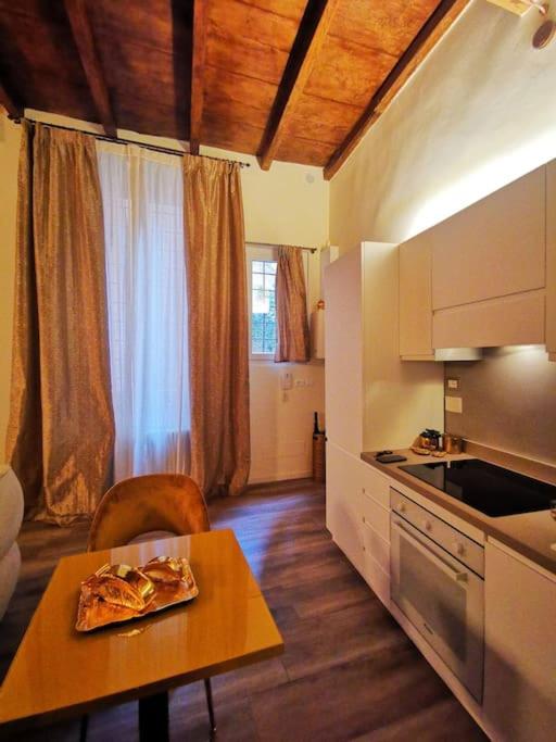 A kitchen or kitchenette at DeChiari21 Boutique Home