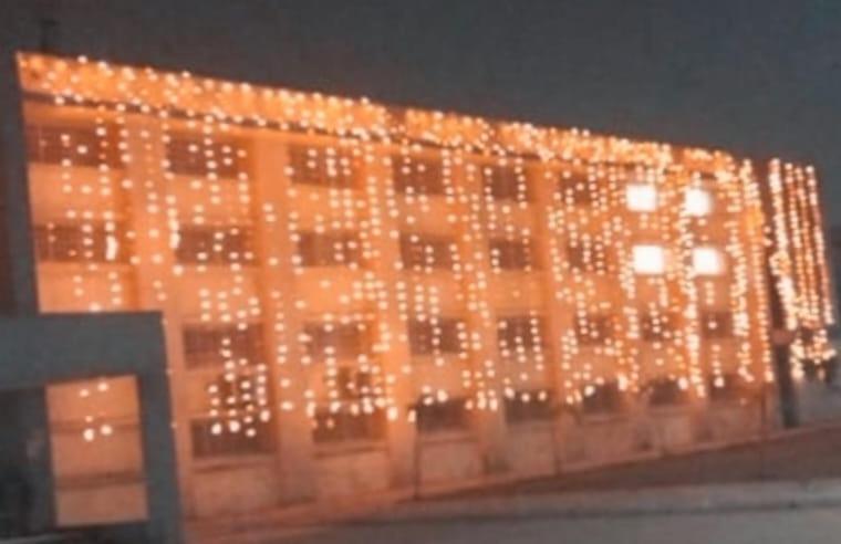a lit up building with christmas lights on it at Shubhi Rest House and Restaurant in Sehore
