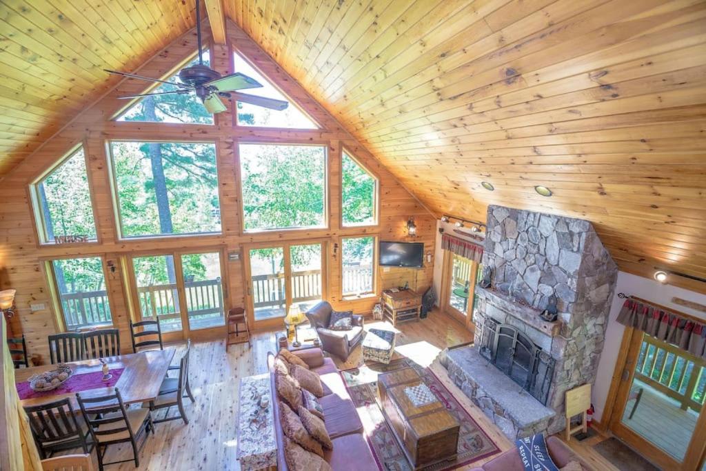 an overhead view of a living room with a fireplace at The Hive Trailside At Pleasant Mnt Ski Area in Bridgton