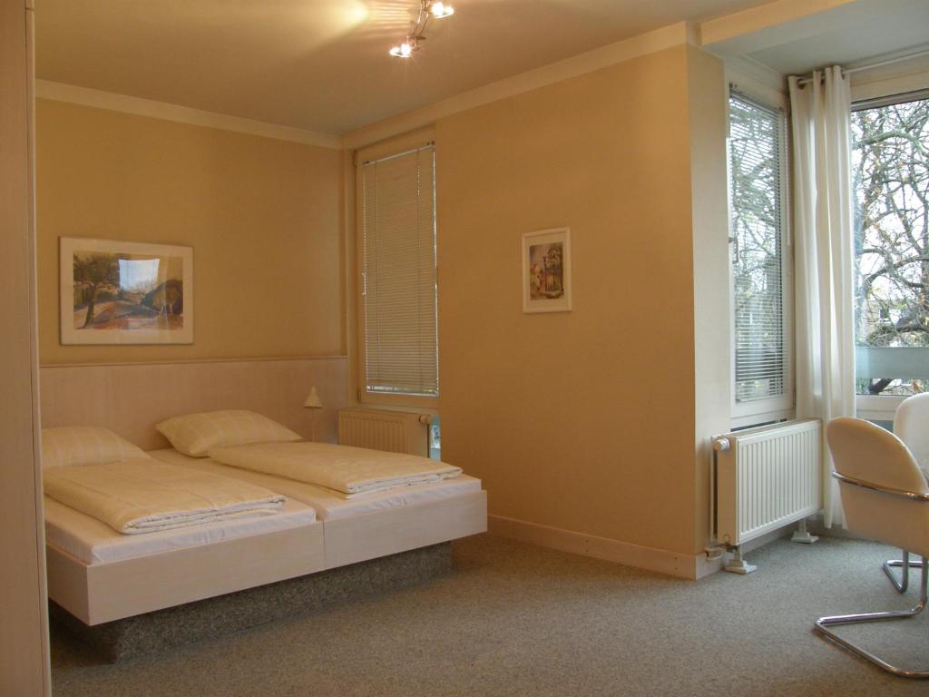 Postel nebo postele na pokoji v ubytování Hotel St.-Michaels-Heim