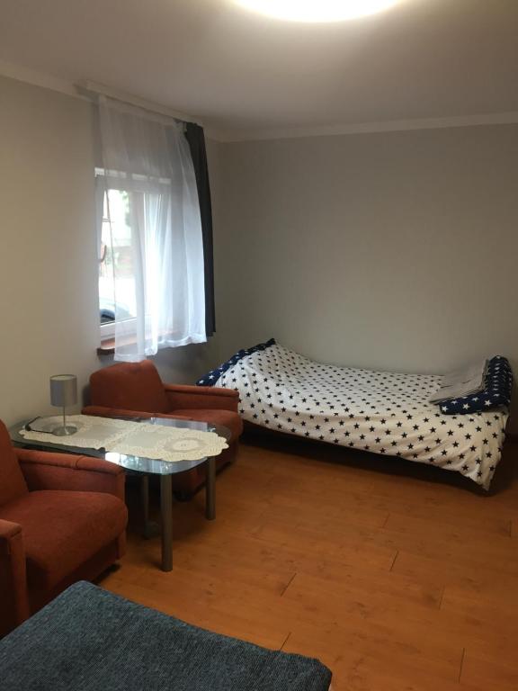 Posteľ alebo postele v izbe v ubytovaní Apartament Augustów