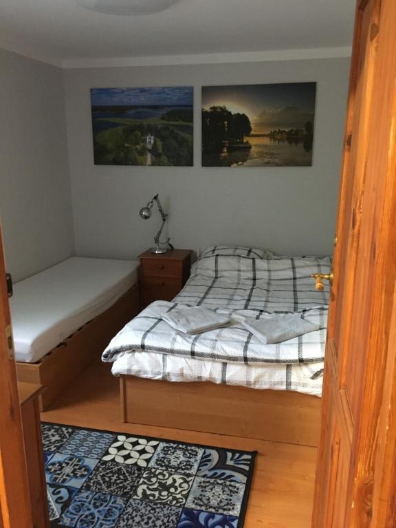 Posteľ alebo postele v izbe v ubytovaní Apartament Augustów