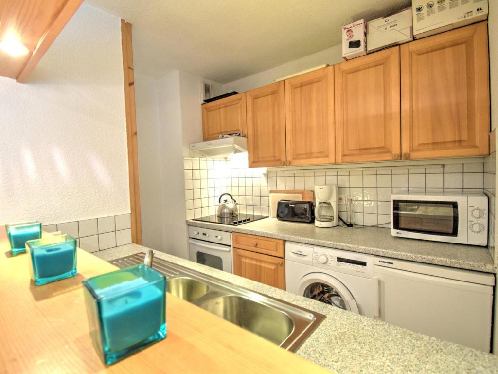 a kitchen with a sink and a counter top at Appartement Morzine, 2 pièces, 6 personnes - FR-1-524-41 in Morzine