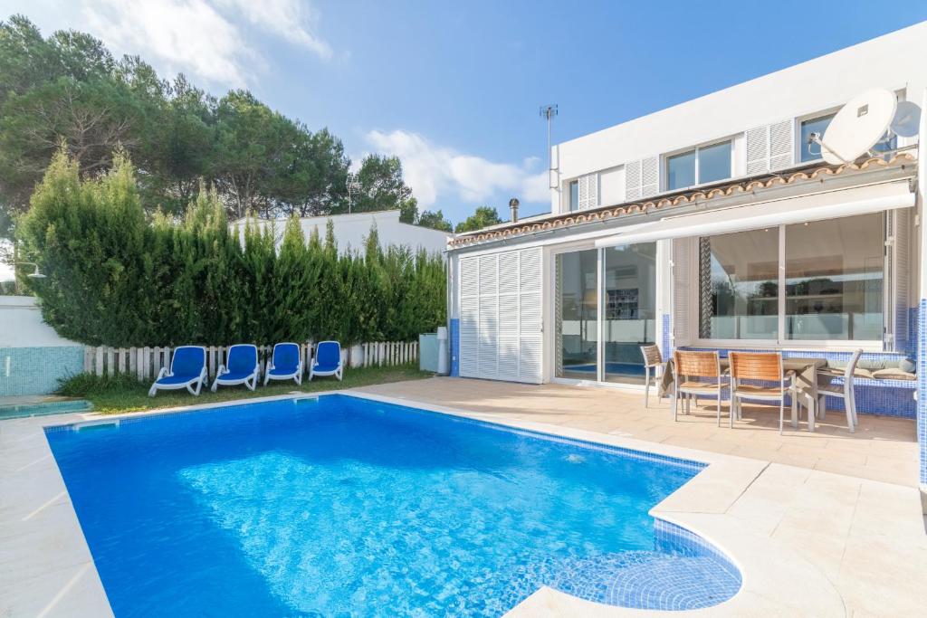 a swimming pool in the backyard of a house at Son serra de marina - 27077 Mallorca in Son Serra de Marina