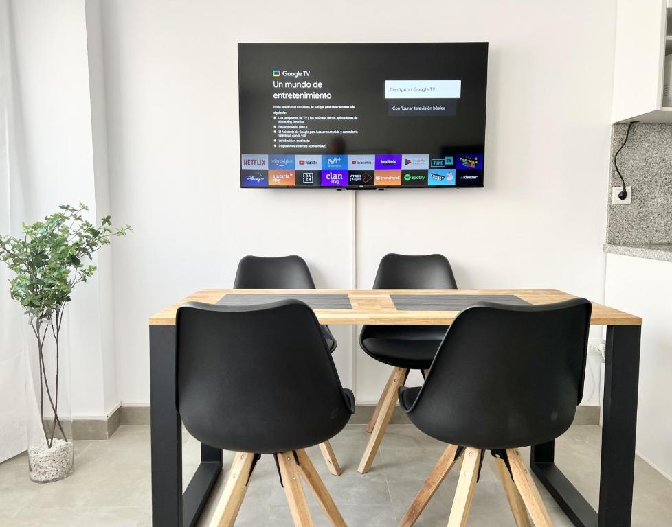 Televízia a/alebo spoločenská miestnosť v ubytovaní Huerta 7