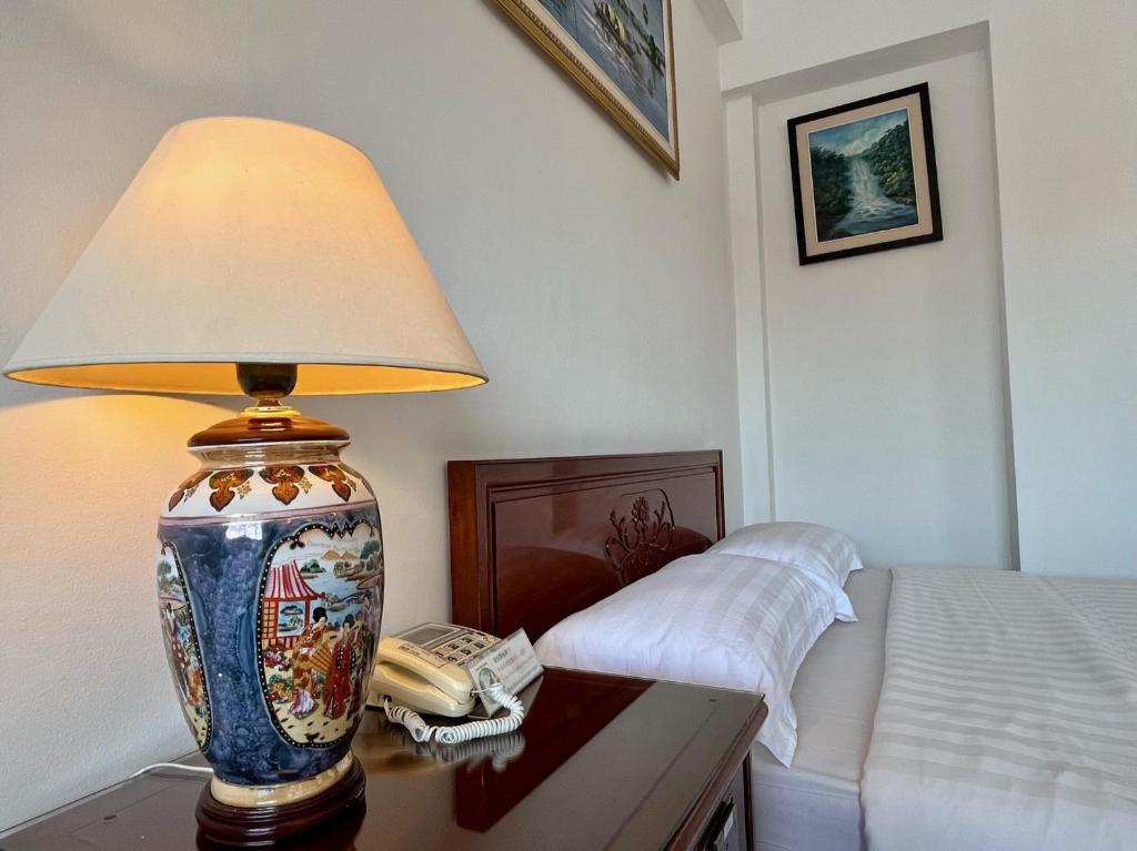 Postel nebo postele na pokoji v ubytování Chung Hsin Hotel 中信酒店