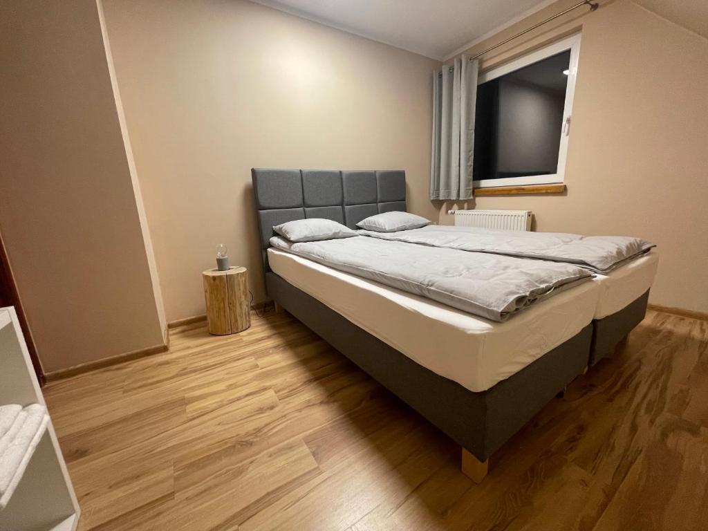 Posteľ alebo postele v izbe v ubytovaní Dom Pod Świerkami