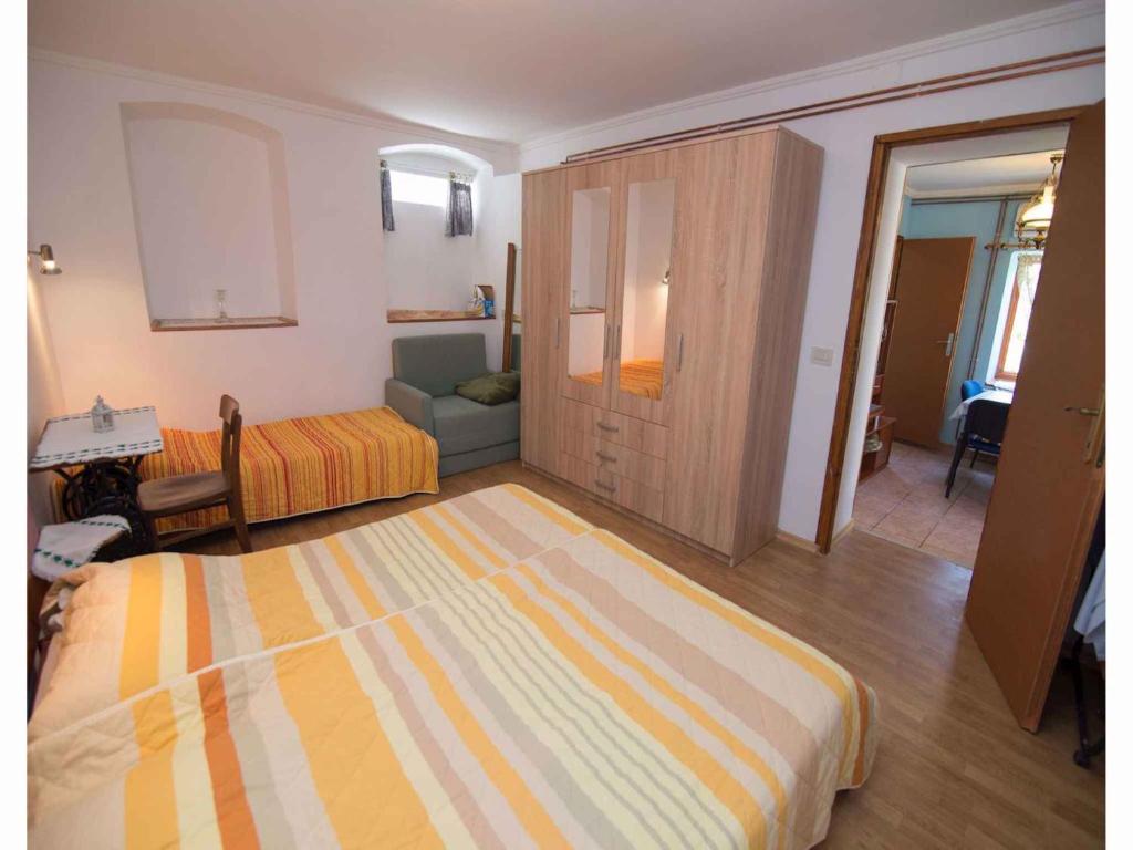 Posteľ alebo postele v izbe v ubytovaní Apartments in Veli Losinj 14928