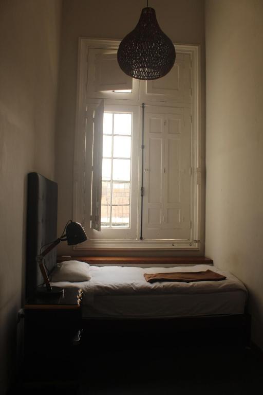 Postel nebo postele na pokoji v ubytování 1900 Backpacker's Hostel