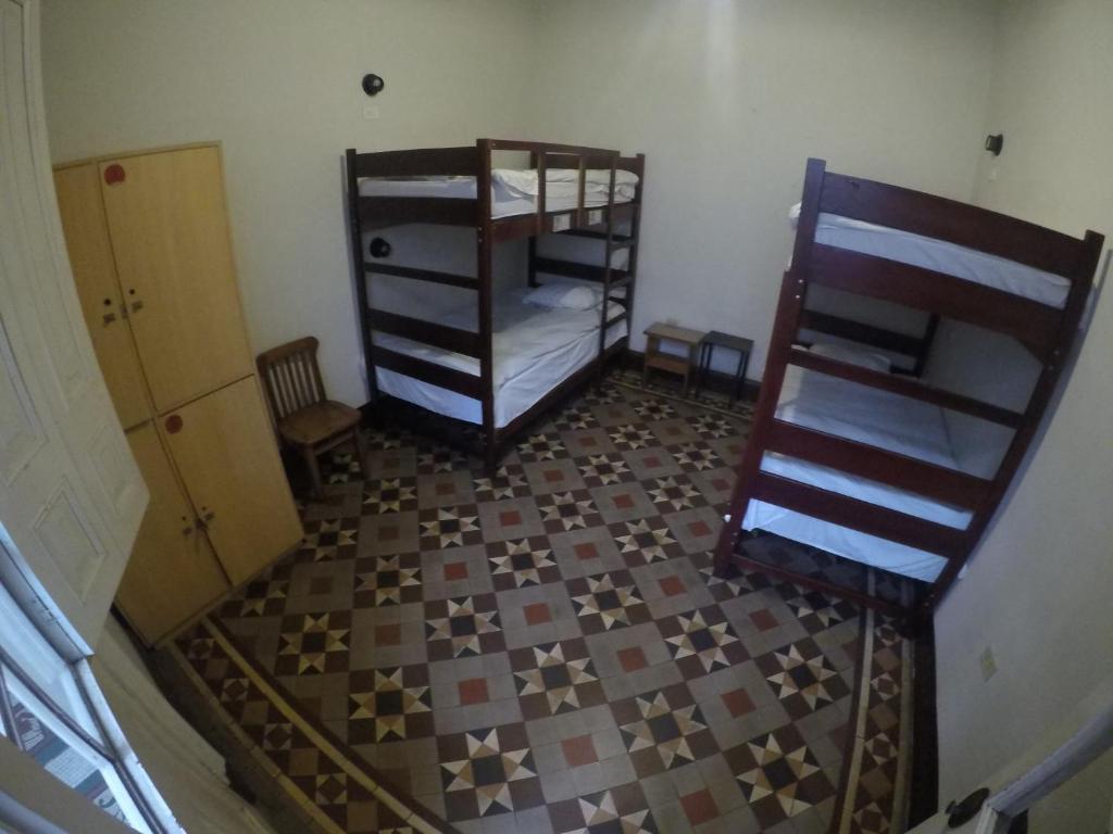 Postel nebo postele na pokoji v ubytování 1900 Backpacker's Hostel