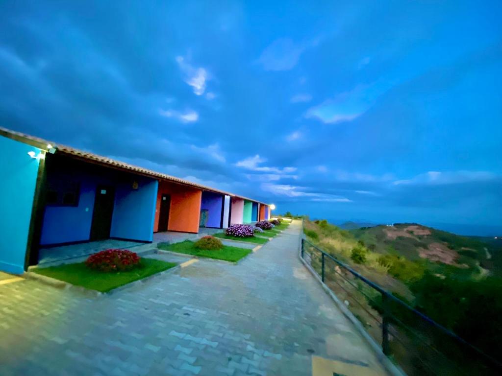 a row of houses on a hill at night at Pousada O Canto do Jacu in Martins