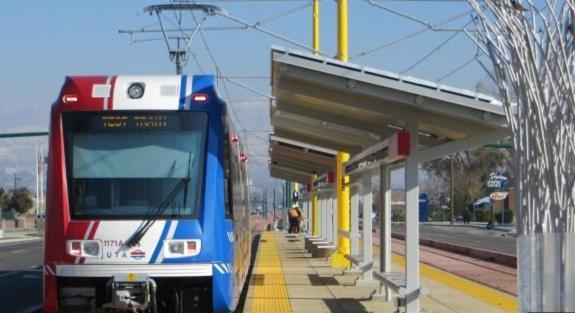 a train is stopped at a train station at Downtown SLC Apt w/amenities in Salt Lake City