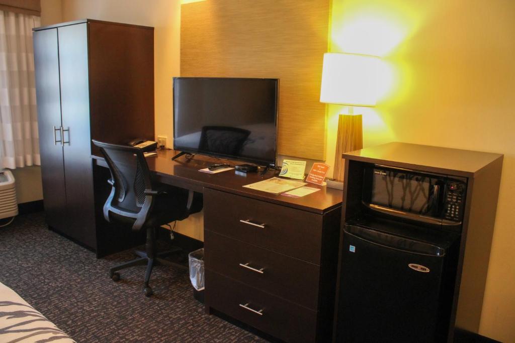 a hotel room with a desk with a computer at Sleep Inn in Bend