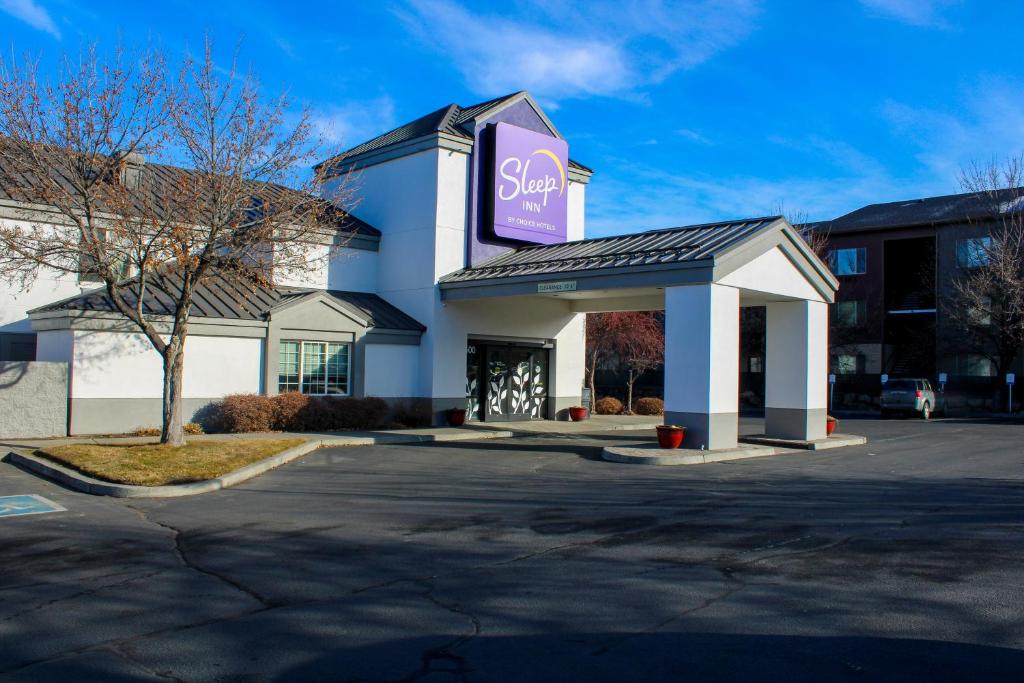 a store with a sign on the front of it at Sleep Inn in Bend