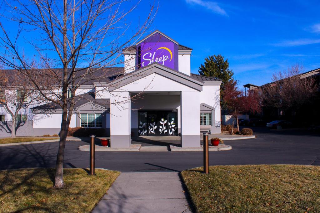 a store with a stop sign on top of it at Sleep Inn in Bend