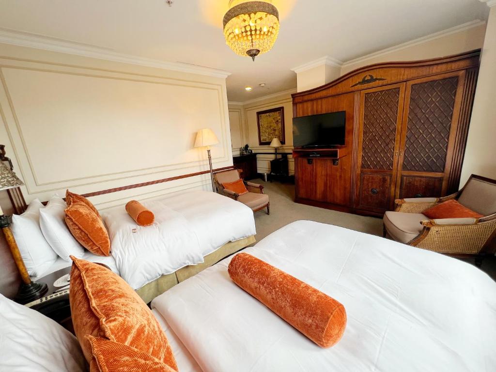 Postel nebo postele na pokoji v ubytování Plaza Grande Hotel