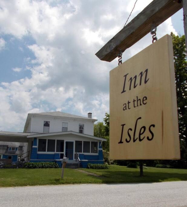 a sign that says im im at the lists in front of a house at Inn at the Isles in Isle la Motte